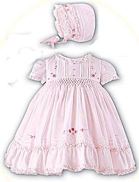 Baby's hand smocked dress and bonnet in pink or white. By Sarah Louise
